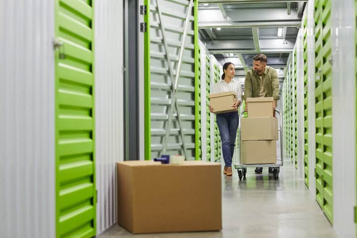 two people walking in a storage unit