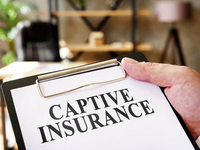 captive insurance typed on a clipboard